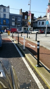 Footpath bollards street furniture separating traffic from cyclists bike path